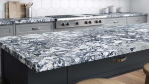 A kitchen counter with black and white marble.