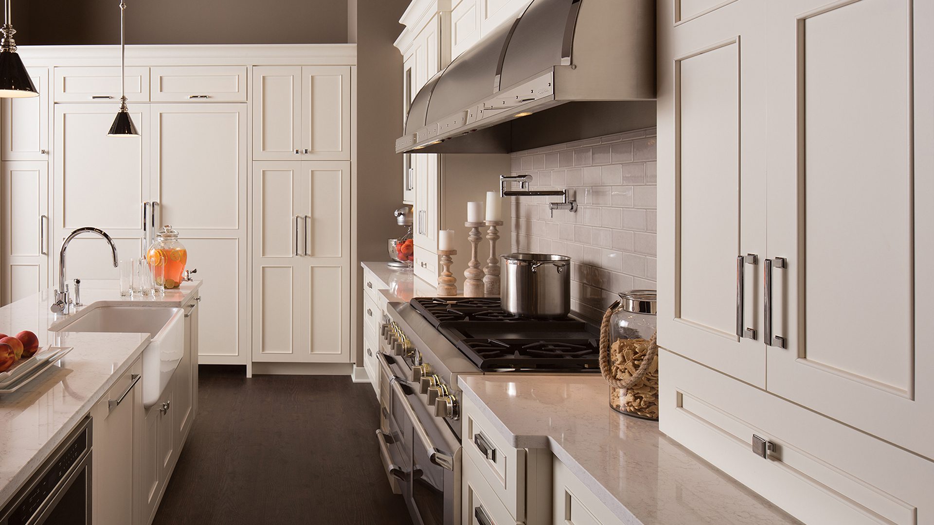 A kitchen with white cabinets and a stove.