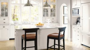 A kitchen with two chairs and a counter