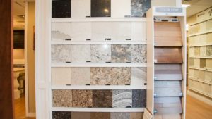 A shelf with many different types of marble.