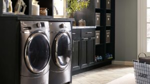 A black and silver laundry room with two machines