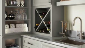 A kitchen with a wine rack and cabinets
