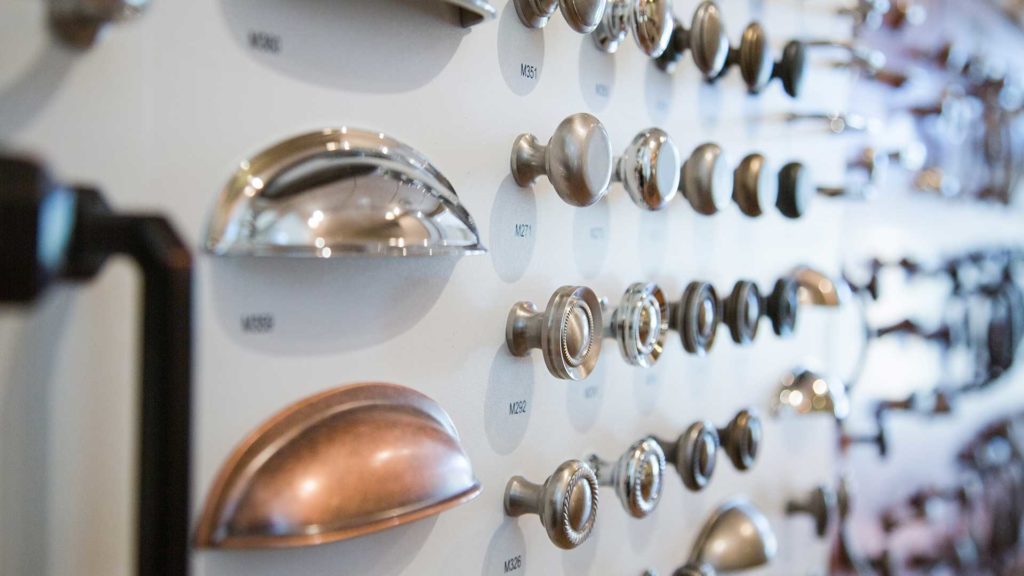 A wall of different types of knobs and handles.