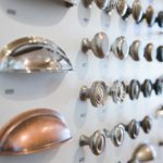 A wall of different types of knobs and handles.