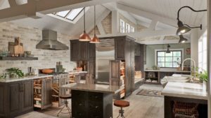 A kitchen with an island and vaulted ceiling.