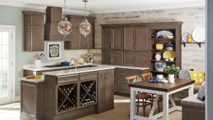 A kitchen with wooden cabinets and wine racks.