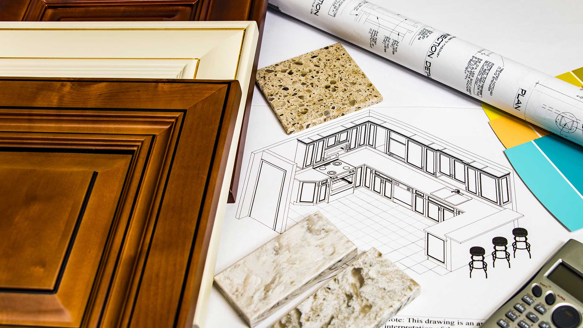 A kitchen with cabinets, counter tops and floor plans.