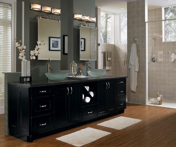 A bathroom with a large sink and wooden floor