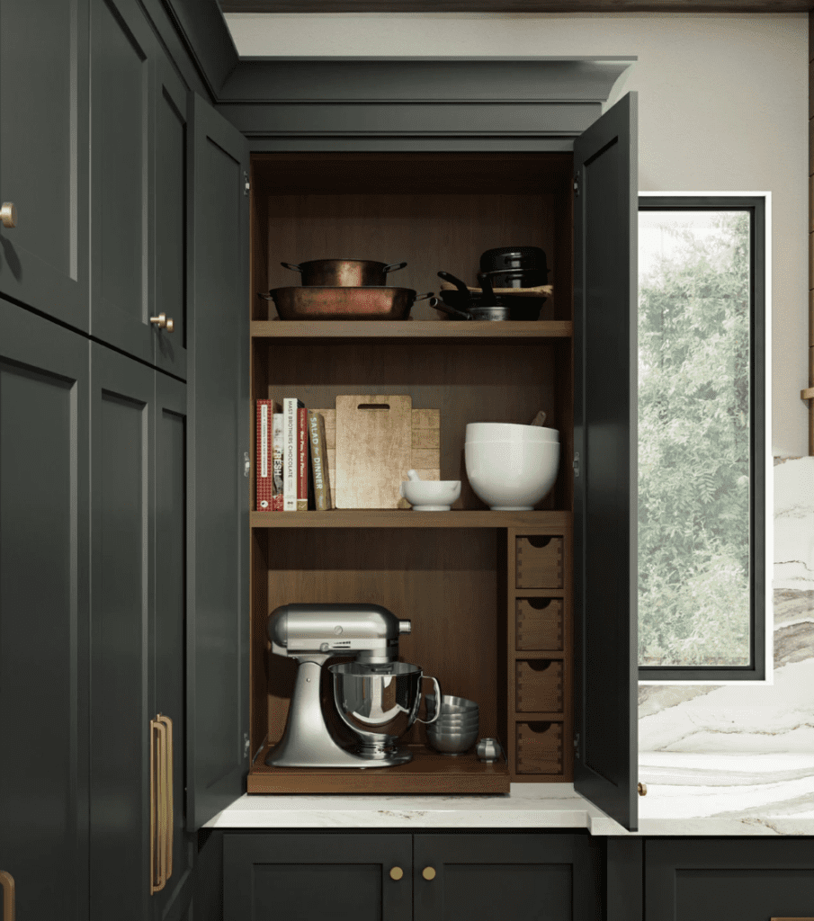A kitchen with an open cabinet and drawers.