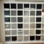 A wall of different types of granite and marble.