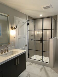 Modern bathroom with black framed shower.