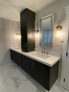 Modern bathroom vanity with white countertop.