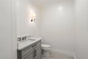 Minimalist bathroom with toilet and sink.