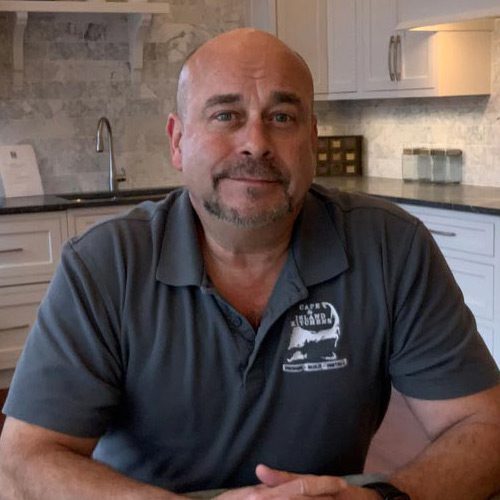 mark-headshot A man sitting in front of a kitchen counter.